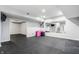 Basement area, with mirrors on the wall to make the room feel larger at 1510 Continental Dr, Zionsville, IN 46077