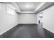 A clean basement with an open floor plan and sliding barn doors at 1510 Continental Dr, Zionsville, IN 46077