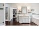 Elegant bathroom featuring a soaking tub, vanity with storage, and a walk-in shower at 1510 Continental Dr, Zionsville, IN 46077