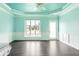 Bright bonus room with a fan, a view of the yard, and modern wainscotting at 1510 Continental Dr, Zionsville, IN 46077