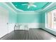 Bright bonus room with a unique ceiling, a view of the yard, and modern wainscotting at 1510 Continental Dr, Zionsville, IN 46077