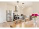 Spacious kitchen with stainless steel appliances, dining area, and natural light, creating an inviting cooking space at 1510 Continental Dr, Zionsville, IN 46077