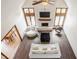 Bright living room featuring a fireplace, vaulted ceilings, and a stylish mix of modern furniture at 1510 Continental Dr, Zionsville, IN 46077