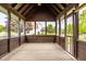 Relaxing screened-in porch with wood flooring, offering a serene outdoor living space at 1510 Continental Dr, Zionsville, IN 46077