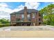 Expansive brick home with a deck overlooking a pool, perfect for outdoor entertaining at 16285 Remington Dr, Fishers, IN 46037