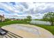 Backyard view of the pool, fence, lawn and lake view at 16285 Remington Dr, Fishers, IN 46037