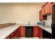 Finished bar area with cabinetry, countertop, sink, beer tap, microwave, and minifridge at 16285 Remington Dr, Fishers, IN 46037