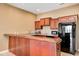 Finished bar area includes a bar counter, cabinets, sink, beer tap, and microwave at 16285 Remington Dr, Fishers, IN 46037