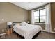 Comfortable bedroom featuring a black metal bed frame and a large window for natural light at 16285 Remington Dr, Fishers, IN 46037