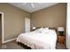 Neutral bedroom with a black metal bed frame, lamps, and soft textures for a relaxing space at 16285 Remington Dr, Fishers, IN 46037