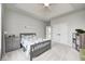 Comfortable bedroom with light-colored walls, a tray ceiling, and neutral carpet at 16285 Remington Dr, Fishers, IN 46037