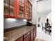 Butler pantry boasts cabinetry, counter space, and under-cabinet lighting at 16285 Remington Dr, Fishers, IN 46037