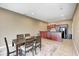Dining area with dark wood table, seating for six, and a built-in kitchen area at 16285 Remington Dr, Fishers, IN 46037