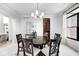 Elegant dining room features a chandelier, wainscoting, and a large round table with seating at 16285 Remington Dr, Fishers, IN 46037