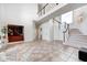 Spacious foyer boasts tile floors, soaring ceilings, and an open staircase with black accents at 16285 Remington Dr, Fishers, IN 46037