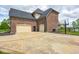 Spacious three-car garage with ample parking space and a basketball hoop for recreational activities at 16285 Remington Dr, Fishers, IN 46037