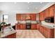Spacious kitchen featuring classic cabinetry and tile flooring at 16285 Remington Dr, Fishers, IN 46037