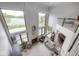 Spacious living room with soaring ceilings, fireplace, and expansive lake views at 16285 Remington Dr, Fishers, IN 46037