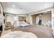 Open-concept living area features a fireplace, plush seating, and a view into a playroom at 16285 Remington Dr, Fishers, IN 46037