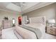 Spacious main bedroom with tray ceilings, neutral tones, and an ensuite bathroom at 16285 Remington Dr, Fishers, IN 46037