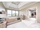 Airy main bedroom with lake views through large windows and ensuite access at 16285 Remington Dr, Fishers, IN 46037