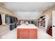 Spacious walk-in closet with island, custom shelving, and ample storage for clothes and accessories at 16285 Remington Dr, Fishers, IN 46037