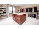 Large walk-in closet with custom shelving, clothing racks, and a center island at 16285 Remington Dr, Fishers, IN 46037