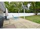 Spacious backyard with lush green lawn, patio, and lounge chairs at 1701 Lincoln Rd, Speedway, IN 46224