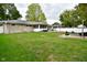 Spacious backyard with patio, fire pit and landscaping at 1701 Lincoln Rd, Speedway, IN 46224