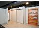 Finished basement with bookshelf, closet, and water heater at 1701 Lincoln Rd, Speedway, IN 46224