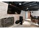 Basement with a fireplace, TV, and an entertainment bar area with seating at 1701 Lincoln Rd, Speedway, IN 46224