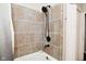 Bathroom with tiled shower featuring modern matte black hardware fixtures at 1701 Lincoln Rd, Speedway, IN 46224