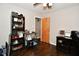 Bedroom featuring hardwood floors, an open doorway, and a storage shelf at 1701 Lincoln Rd, Speedway, IN 46224