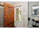 Welcoming entryway featuring a modern front door and stylish decor elements and wood floors at 1701 Lincoln Rd, Speedway, IN 46224
