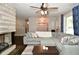 Inviting living room with a stone fireplace, large sectional sofa, and open layout at 1701 Lincoln Rd, Speedway, IN 46224