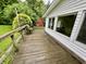 Spacious wooden deck area with a built-in bench, perfect for outdoor relaxation and entertaining at 1949 Shenandoah Pl, Indianapolis, IN 46229