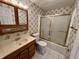 Bathroom featuring vanity, toilet, and shower with glass door at 1949 Shenandoah Pl, Indianapolis, IN 46229