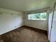 Bedroom featuring carpeted floors and bright window with backyard view at 1949 Shenandoah Pl, Indianapolis, IN 46229