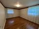 Bedroom with hardwood floors, closet, and bright windows at 1949 Shenandoah Pl, Indianapolis, IN 46229