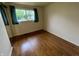 This cozy bedroom has beautiful wood floors and a bright window that provides plenty of natural light at 1949 Shenandoah Pl, Indianapolis, IN 46229