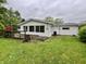Back of home view showing a deck and sunroom at 1949 Shenandoah Pl, Indianapolis, IN 46229