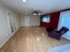 Inviting living room with bright wood laminate floors and a ceiling fan for year-round comfort at 1949 Shenandoah Pl, Indianapolis, IN 46229