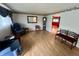 Bright living room featuring laminate floors and antique furniture with a view to the yard at 1949 Shenandoah Pl, Indianapolis, IN 46229
