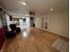 Spacious living room with hardwood floors that lead to a bright kitchen, perfect for entertaining at 1949 Shenandoah Pl, Indianapolis, IN 46229
