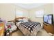 Cozy bedroom with warm neutral colors, comfortable bed, and two windows for natural light at 209 E 35Th St, Anderson, IN 46013