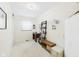 Well-lit bedroom featuring a desk, shelving unit, and neutral carpet for a comfortable workspace at 209 E 35Th St, Anderson, IN 46013
