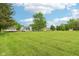 Expansive, well-manicured backyard featuring a house, truck, and outbuilding, perfect for outdoor activities at 2444 S Brandywine Ct, Greenfield, IN 46140