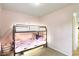 Bedroom featuring a bunk bed, pink walls, and carpet flooring at 2444 S Brandywine Ct, Greenfield, IN 46140