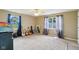 Bedroom with two windows and guitars on the floor in a home for sale at 2444 S Brandywine Ct, Greenfield, IN 46140