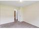 Bedroom with carpet flooring, neutral walls, and an adjoining bathroom at 2444 S Brandywine Ct, Greenfield, IN 46140